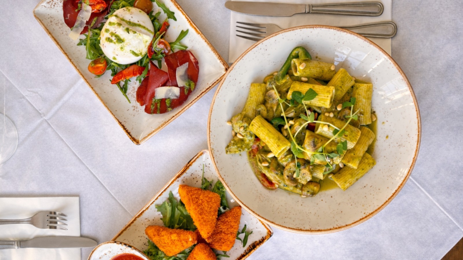 Rigatoni with pesto, burrata salad and arancini
